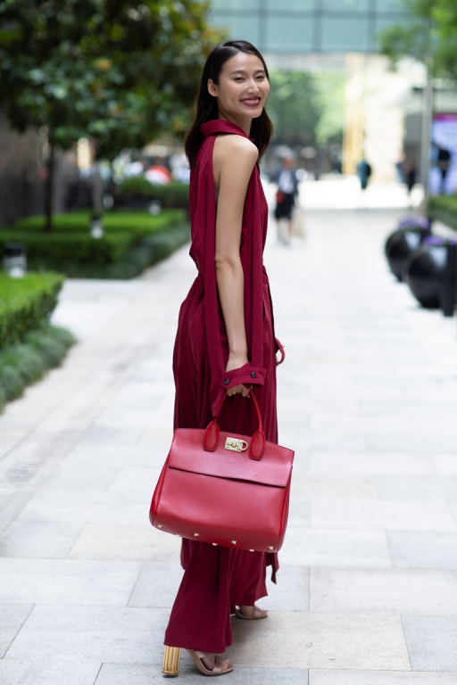Chinese Super Model Wang Shiqing carries Ferragamo Studio Bag, wears FW18 dress