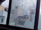 Hàng loạt cửa kính nhà dân ở trung tâm TPHCM bị bắn vỡ